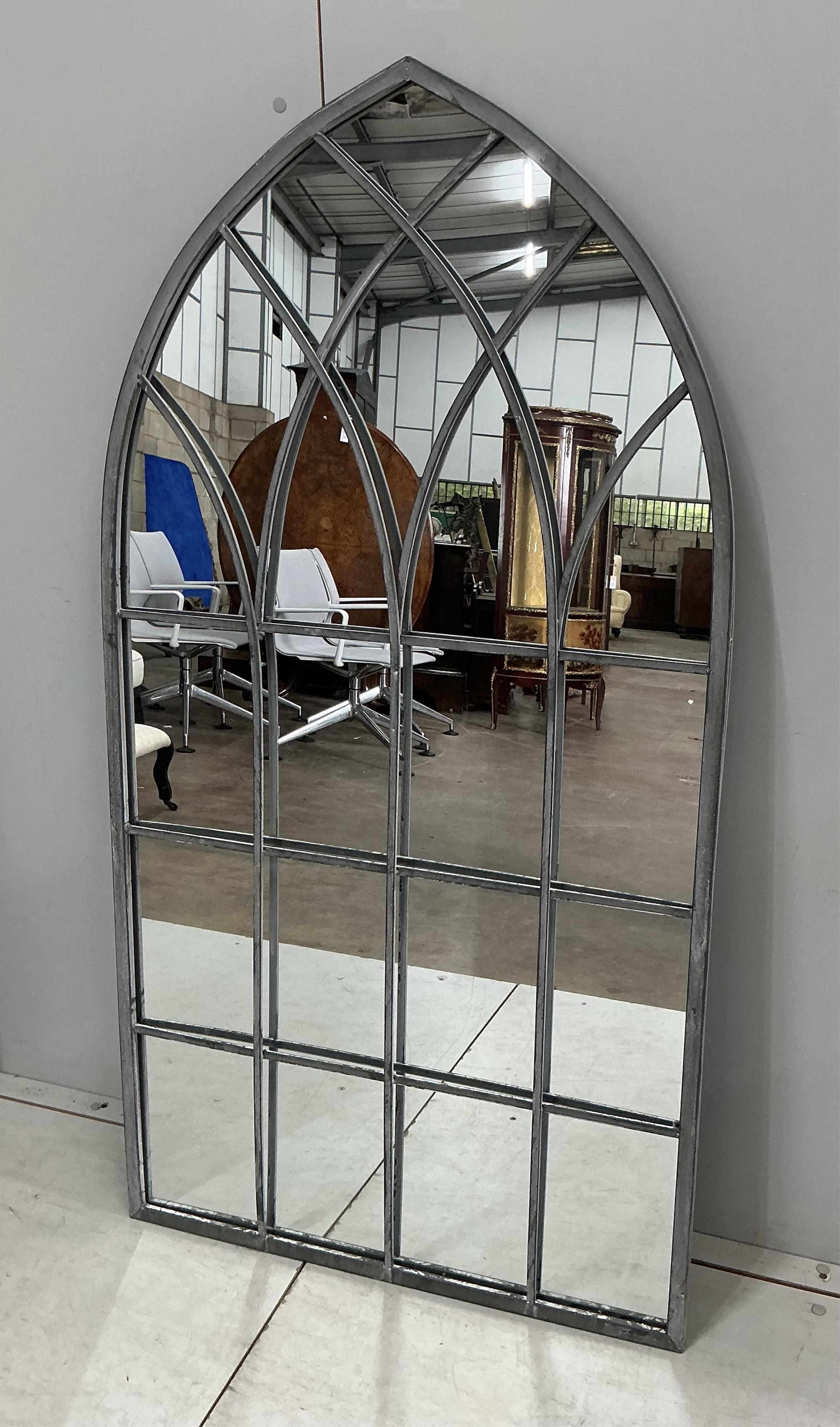 A pair of modern Gothic style arched window frame style wall mirrors, width 71cm, height 138cm
